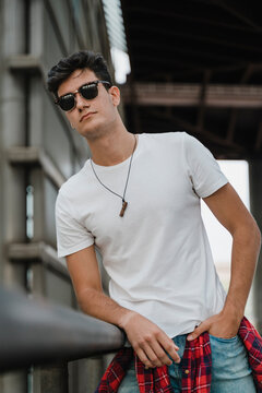 Young man waiting at train station