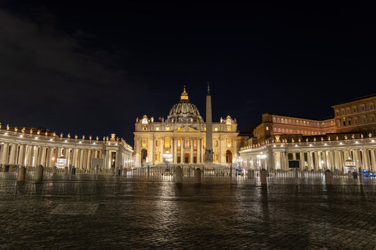 Illuminated St. Peter's Square with obelisk and St. Peter's Basilica against clear sky at night, Vatican City, Rome, Italy