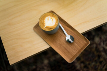 Cppuccino on a tray in a coffee shop, elevated veiw
