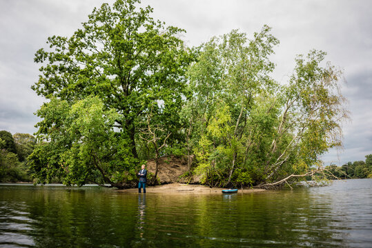 Businessman at a lonely island in a lake