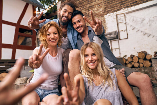 Friends having fun in a backyard in the summer