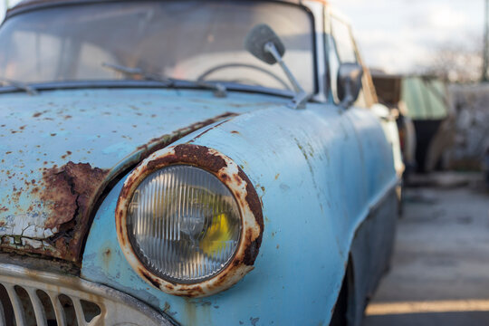 Rusty car in a scrapyard