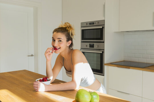 Female teenager during breakfast in the kitchen