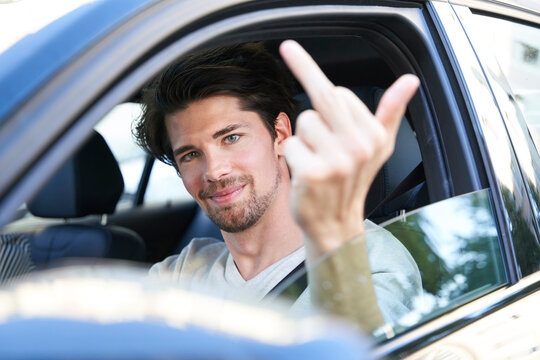 Portrait of smiling man driving car