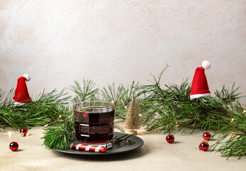 Christmas boozy cranberry gin cocktail, or mulled wine. served on the table with holidays decoration