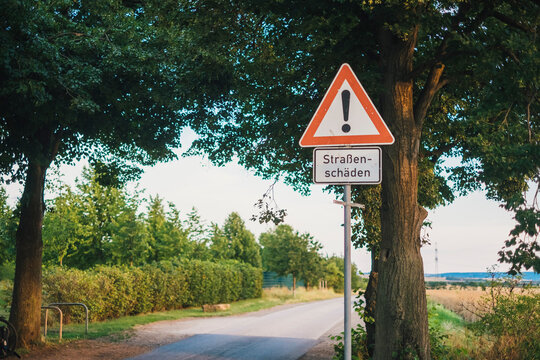 Germany, warning sign 'roadway damages'