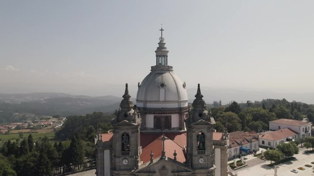 Church dome and bell towers, Sameiro Sanctuary, Braga, Portugal. Aerial pullback 