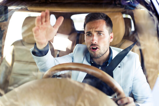 Ranting businessman, driving in his car