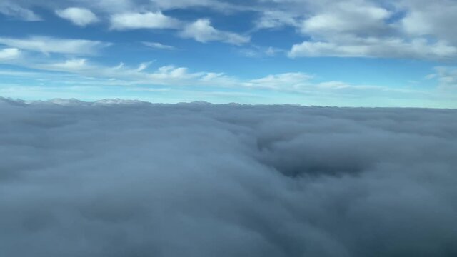Cockpit view overflying clouds in the moorning in the Balearic Islands