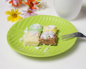 Sweet getuk lindri cake sprinkled with grated coconut as a savory taste enhancer. Getuk is usually made from cassava or cassava. Has a soft texture. Traditional snacks. Focus blur. Focus on some angel