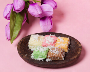 Sweet getuk lindri cake sprinkled with grated coconut as a savory taste enhancer. Getuk is usually made from cassava or cassava. Has a soft texture. Traditional snacks. Focus blur. Focus on some angel