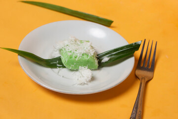 Sweet getuk lindri cake sprinkled with grated coconut as a savory taste enhancer. Getuk is usually made from cassava or cassava. Has a soft texture. Traditional snacks. Focus blur. Focus on some angel