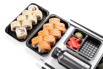 Composition with delicious sushi rolls on white background