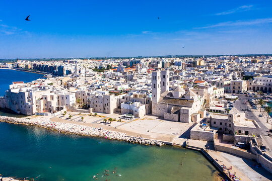 Italy, Province of Bari, Molfetta, Drone view of Mediterranean old town in summer