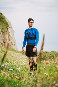 Trail runner standing in nature, Ferrol, Spain