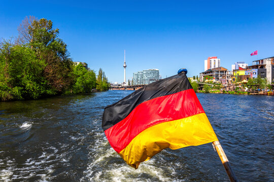 Germany, Berlin, Berlin TV Tower with Spree and German Flag