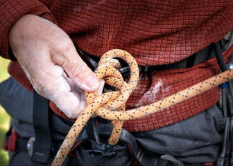 Tying a figure of eight to a rock climbing harness