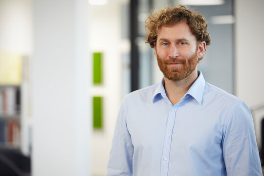 Portrait of a confident businessman in office - Powered by Adobe