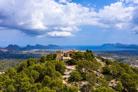 Spain, Balearic Islands, Majorca, Pollena, Town and Santuario del Puig de Maria, aerial view