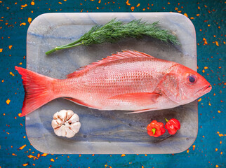 Tray with raw red snapper