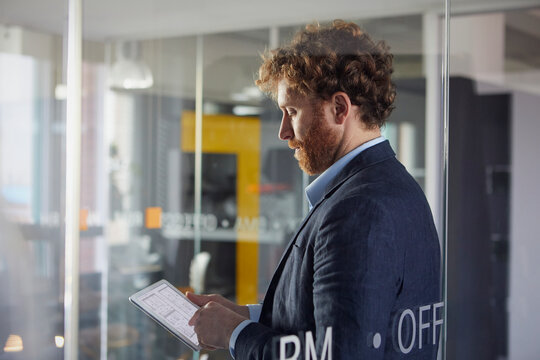 Businessman using a tablet in office