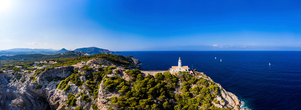 Spain, Mallorca, Cala Ratjada, Helicopter view of Far de Capdepera lighthouse in summer