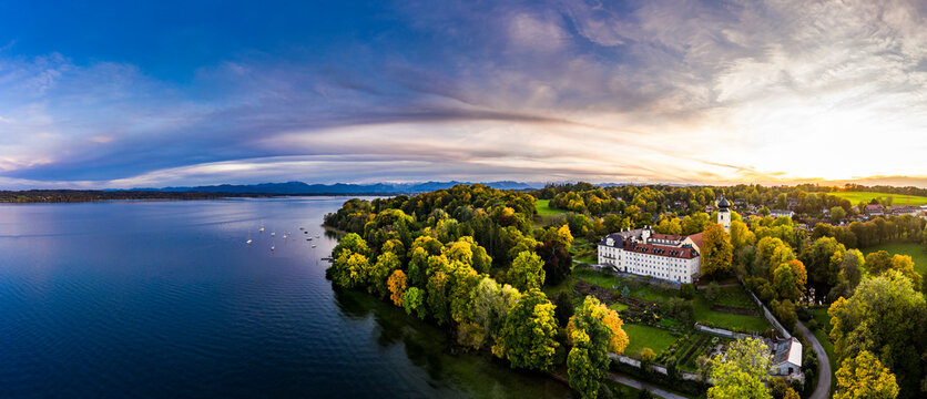 Germany, Bavaria, Bernried am Starnberger See, Drone panorama of Lake Starnberg and Bernried Abbey at summer sunset