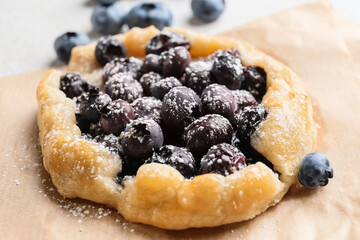 Tasty blueberry galette on table, closeup