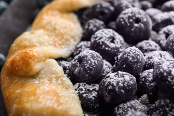 Tasty blueberry galette on table, closeup