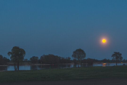 Full moon above River Elbe, Hitzacker, Lower Saxony, Germany