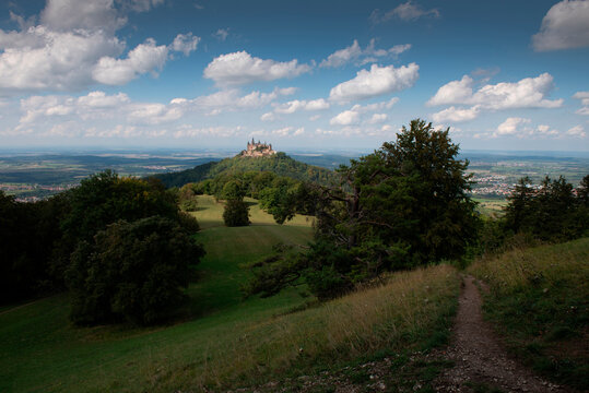 Burg Hohenzollern on mountain peak against sky at Swabian Alb, Germany