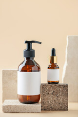 Amber glass bottles on travertine podiums. Mock up. Natural organic eco cosmetic, beauty products...