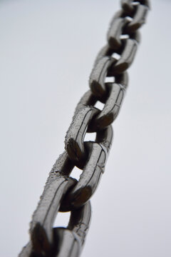 Germany, Close-up of black colored chain made of chromed steel