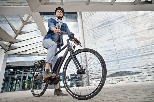 Student on his e-bike at Goethe University in Frankfurt, Germany
