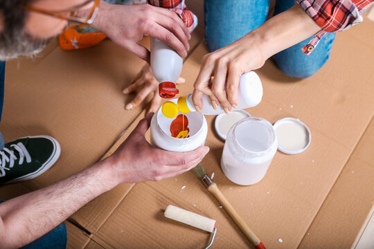 Couple mixing the colours for painting