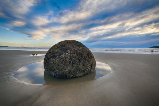 New Zealand, Otago coast, Moeraki Boulders on Koekohe Beach with dramatic sky