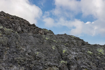 photo of sulfurous soil and clouds and sky