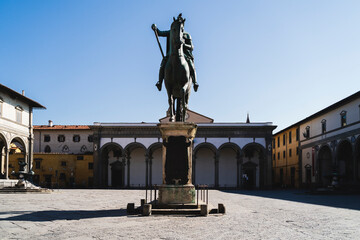 Italy, Tuscany, Florence, Empty Piazza della Santissima Annunziata with equestrian monument of Ferdinando I amid Coronavirus pandemic