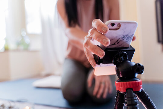 Mature woman with smartphone in attachment