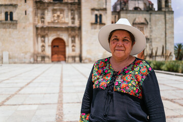 Mexican women adult smiling at camera. Happy smiling Latin American grandmother standing in office...