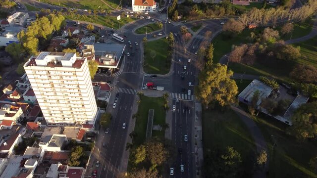 Balbin Avenue fork near park at Buenos Aires, Argentine. Aerial forward tilt up