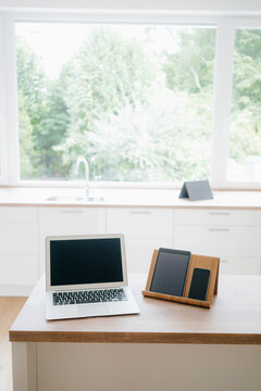 Digital devices on a kitchen block