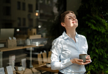 Relaxed businesswoman having a coffee at a cafe