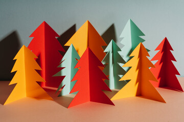 Studio shot of simple paper craft forest trees in autumn colors