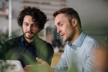 Two businessmen having a meeting in a coffee shop