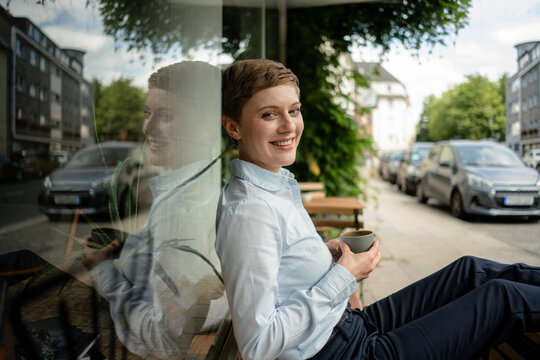 Portrait of a relaxed businesswoman at a cafe