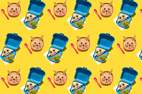 Pattern of bowls and lunch boxes with food decorated with rabbit and anthropomorphic faces