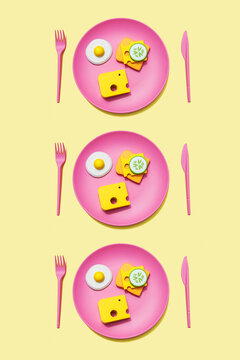 Three dimensional render of plastic plates with bread, cheese and fried eggs