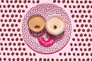 Anthropomorphic face made of plate, halved doughnut and two glasses of coffee