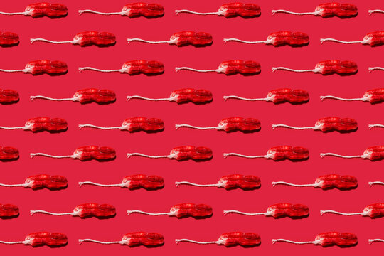 Pattern of used tampons against red background